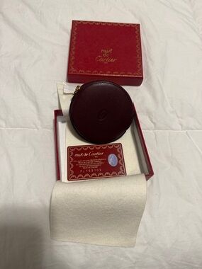 Cartier Red and Gold Coin Purse Authentication Card